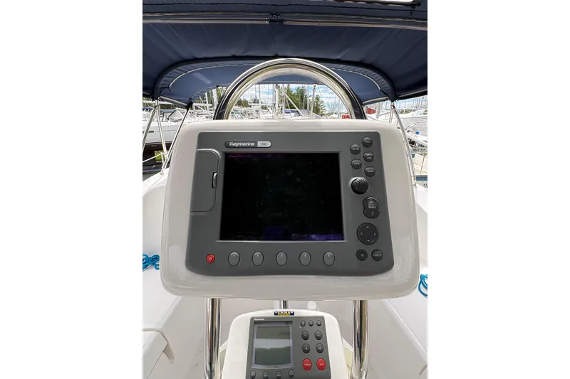 Slide: The Image of Raymarine navigation system on 2009 Hunter 41 Deck Salon yacht, featuring a sleek helm design. - 34