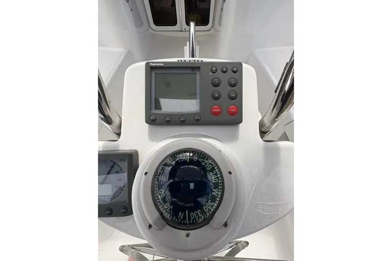 Slide: The Image of Control panel of 2009 Hunter 41 Deck Salon sailboat with compass and navigation instruments. - 35
