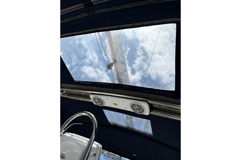 Slide: The Image of Interior view of 2009 Hunter 41 Deck Salon sailboat with skylights and steering wheel. - 38