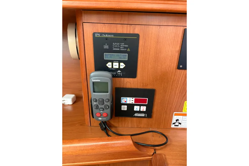 Slide: The Image of Control panel and remote in 2009 Hunter 41 Deck Salon yacht interior. - 46
