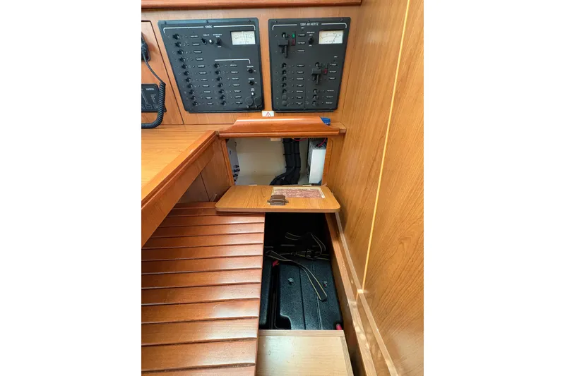 Slide: The Image of Electrical panel and storage area in 2009 Hunter 41 Deck Salon yacht interior. - 50