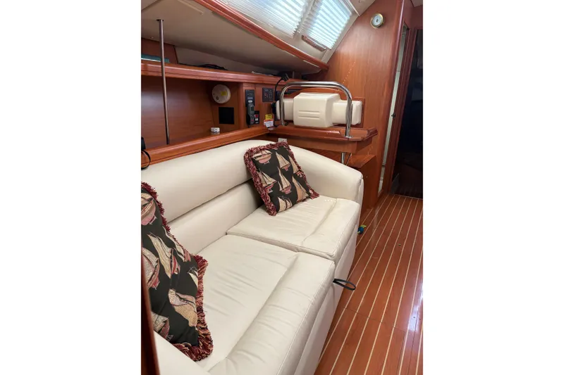 Slide: The Image of Luxurious interior of 2009 Hunter 41 Deck Salon with plush seating and elegant wood finish. - 54