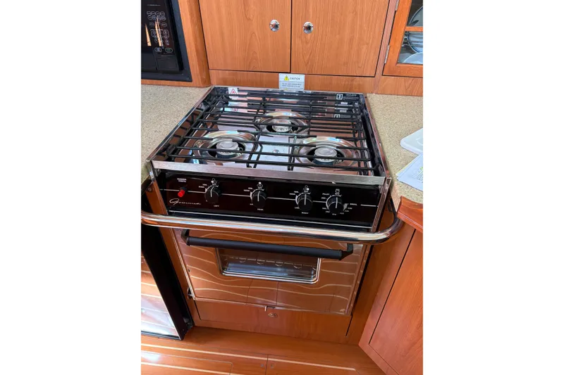 Slide: The Image of Stove and oven in 2009 Hunter 41 Deck Salon yacht kitchen. - 60