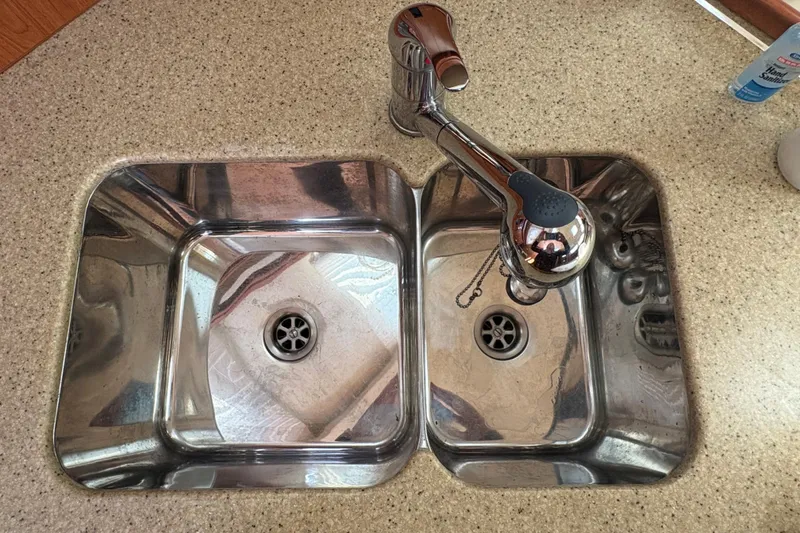 Slide: The Image of Stainless steel double sink with modern faucet on Hunter 41 Deck Salon, 2009 model. - 67