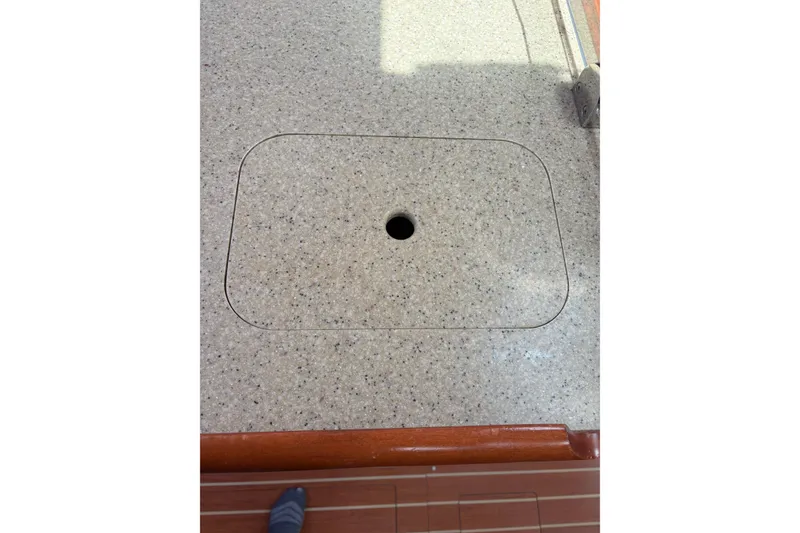 Slide: The Image of Countertop detail on 2009 Hunter 41 Deck Salon yacht, featuring a circular cutout. - 68