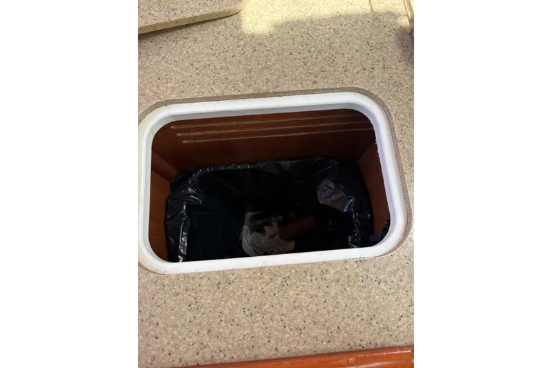 Slide: The Image of Storage compartment on 2009 Hunter 41 Deck Salon yacht with black liner. - 69