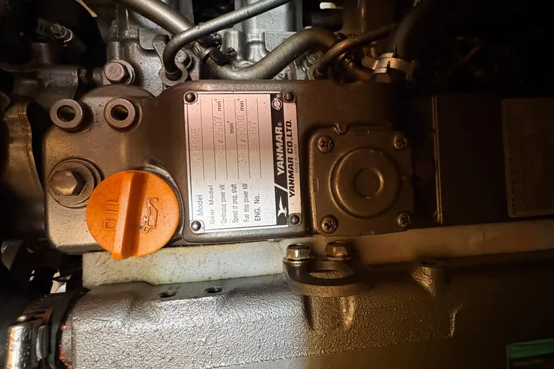 Slide: The Image of Engine compartment of 2009 Hunter 41 Deck Salon with Yanmar components visible. - 71