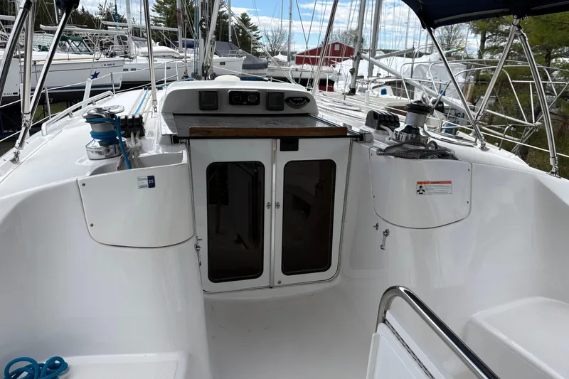 Slide: The Image of 2009 Hunter 41 Deck Salon yacht cockpit with winches and navigation equipment. - 8