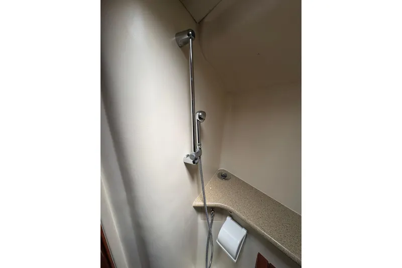 Slide: The Image of Shower area in 2009 Hunter 41 Deck Salon yacht, featuring a sleek chrome showerhead. - 80