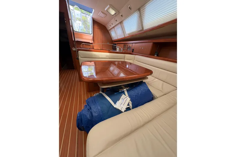 Slide: The Image of Luxurious interior of 2009 Hunter 41 Deck Salon with elegant wood finishes and plush seating. - 86