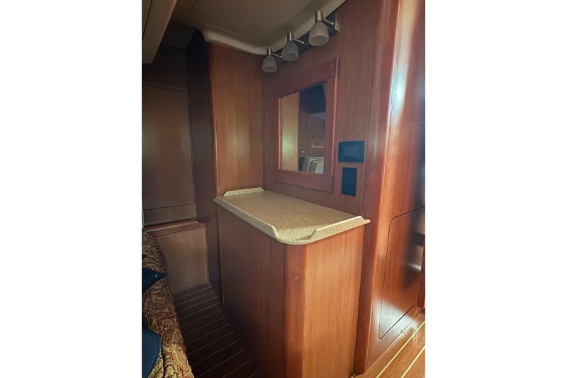 Slide: The Image of Interior of 2009 Hunter 41 Deck Salon with wood finish and countertop. - 92