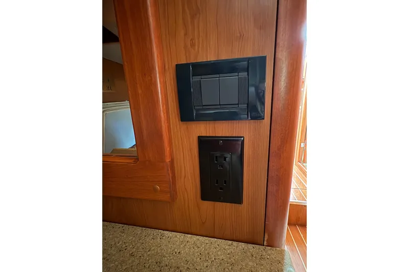 Slide: The Image of Power outlet and switch panel on 2009 Hunter 41 Deck Salon yacht interior. - 93
