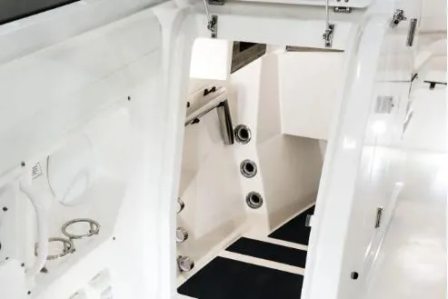 Slide: The Image of Manufacturer Provided Image: Interior view of 2026 Edgewater 262CX Crossover boat, showcasing sleek white design and modern features. - 7