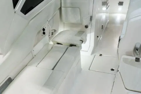 Slide: The Image of Manufacturer Provided Image: Interior of 2026 Edgewater 262CX Crossover boat, featuring sleek white seating and modern design. - 8