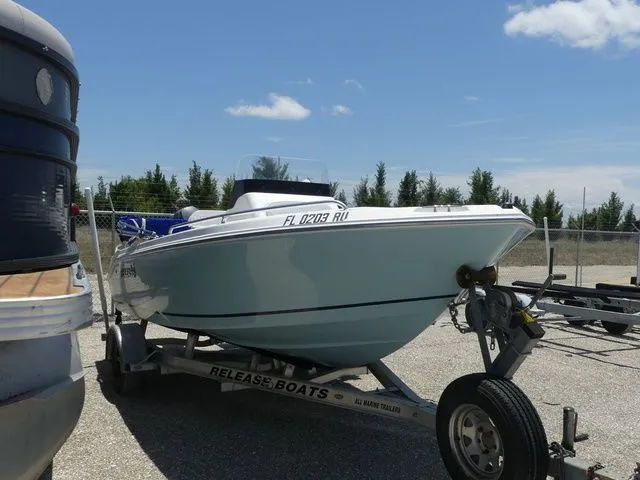 Slide: The Image of 2018 Release 180 RX boat on trailer outdoors. - 3