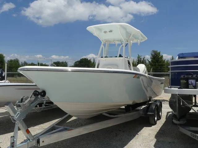 The Image of 2019 Sea Born LX24 Center Console on trailer, blue sky. - 1