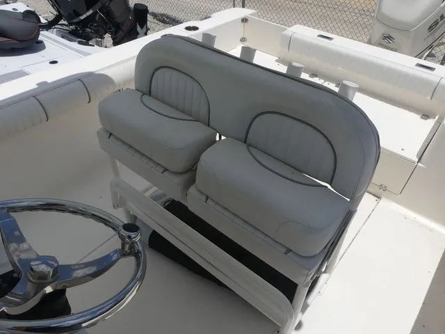 Slide: The Image of 2019 Sea Born LX24 Center Console seating area with steering wheel. - 17