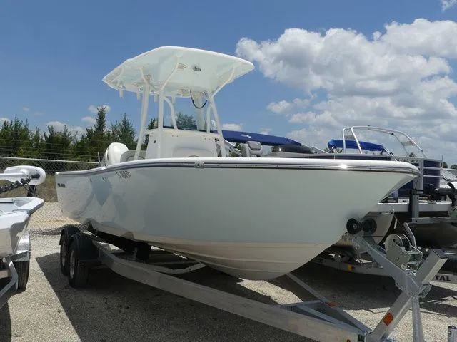 Slide: The Image of 2019 Sea Born LX24 Center Console boat on trailer, blue sky. - 3