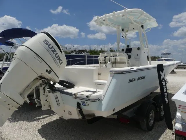 Slide: The Image of 2019 Sea Born LX24 Center Console boat with Suzuki outboard motor. - 4