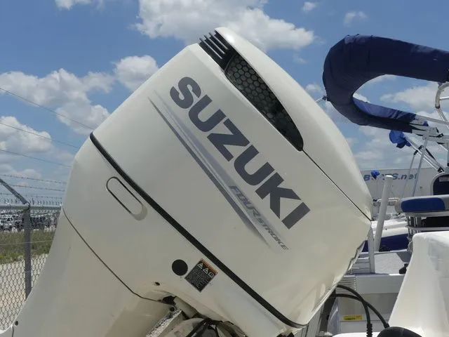 Slide: The Image of Suzuki outboard motor on a 2019 Sea Born LX24 boat. - 9