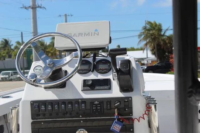 Slide: The Image of Console of a 2005 Action Craft 1890 Flatmaster boat. - 14