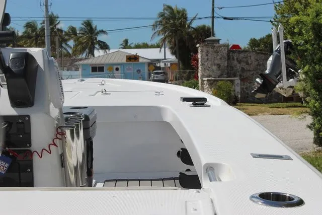 Slide: The Image of 2005 Action Craft 1890 Flatmaster boat in tropical setting. - 15