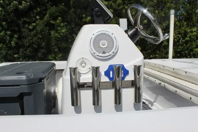 Slide: The Image of 2005 Action Craft 1890 Flatmaster boat console with fishing rod holders. - 18