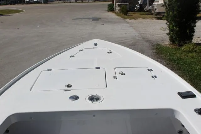 Slide: The Image of 2005 Action Craft 1890 Flatmaster boat deck with storage compartments. - 29