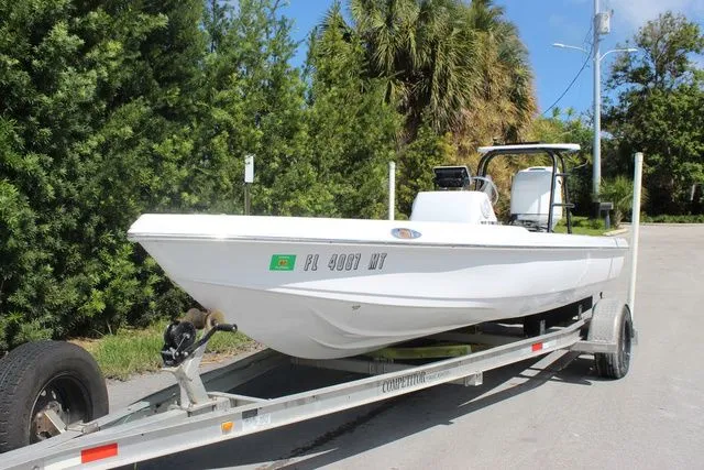 Slide: The Image of 2005 Action Craft 1890 Flatmaster boat on trailer, side view. - 3