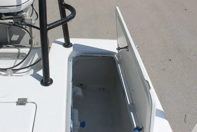 Slide: The Image of 2005 Action Craft 1890 Flatmaster boat with open storage compartment. - 40