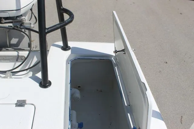 Slide: The Image of 2005 Action Craft 1890 Flatmaster boat with open storage compartment. - 41