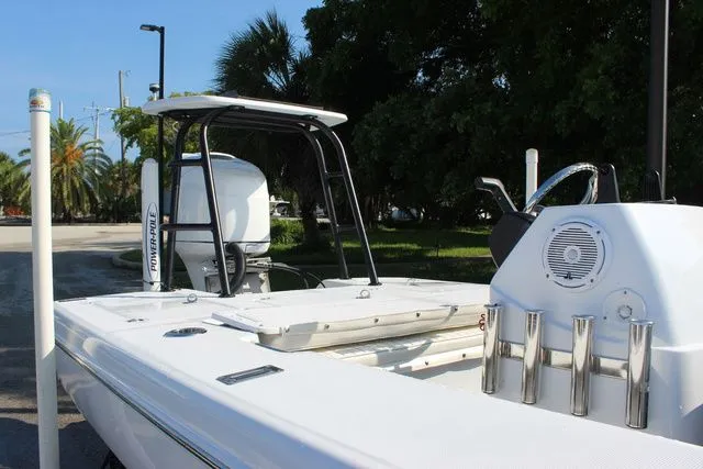 Slide: The Image of 2005 Action Craft 1890 Flatmaster boat with fishing rod holders. - 45