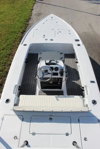 Slide: The Image of 2005 Action Craft 1890 Flatmaster boat, top view, steering console visible. - 48