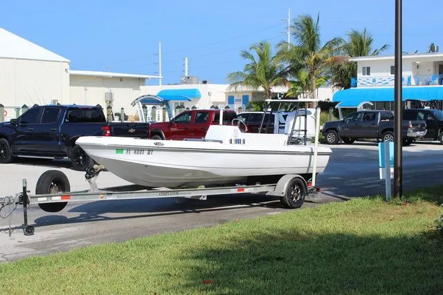 Slide: The Image of 2005 Action Craft 1890 Flatmaster on trailer in sunny setting. - 5