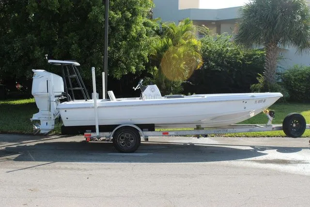 Slide: The Image of 2005 Action Craft 1890 Flatmaster boat on trailer, side view. - 6