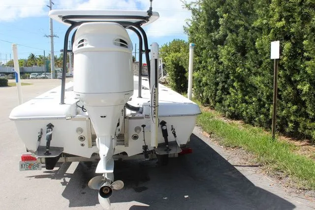 Slide: The Image of Rear view of a 2005 Action Craft 1890 Flatmaster boat on a trailer. - 8