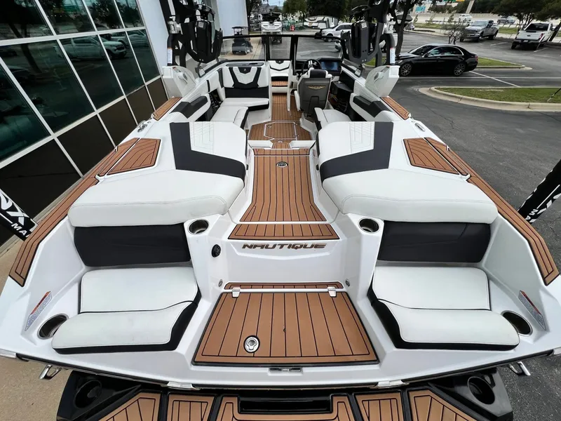Slide: The Image of Interior of a 2021 Nautique G23 boat with luxurious seating. - 11