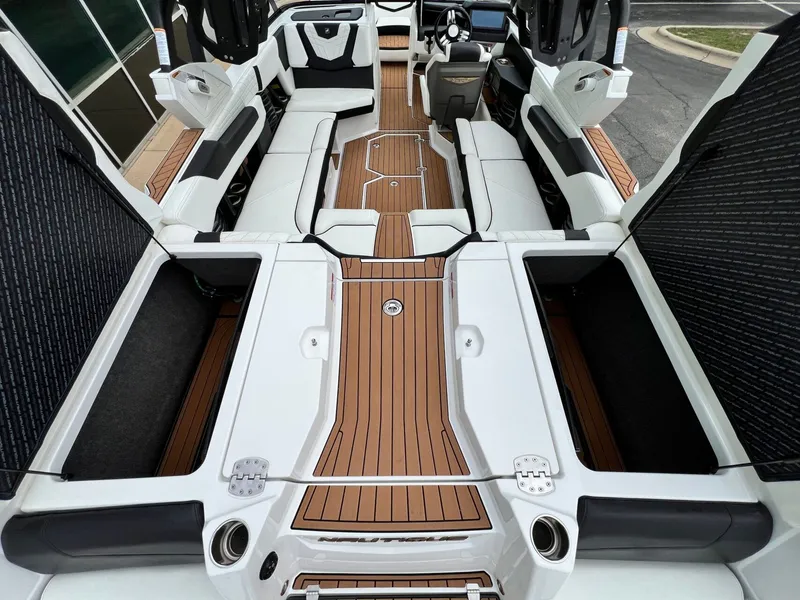 Slide: The Image of Interior of a 2021 Nautique G23 boat with luxurious design. - 12