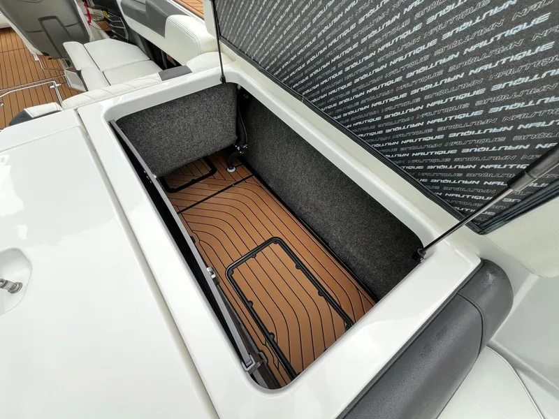 Slide: The Image of Storage compartment in 2021 Nautique G23 boat. - 14