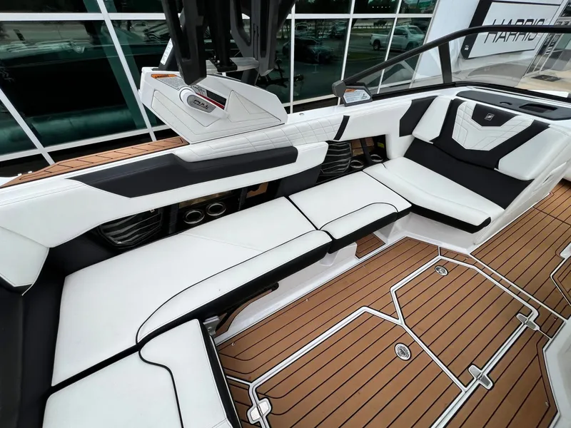 Slide: The Image of Interior of a 2021 Nautique G23 boat with luxurious seating. - 17