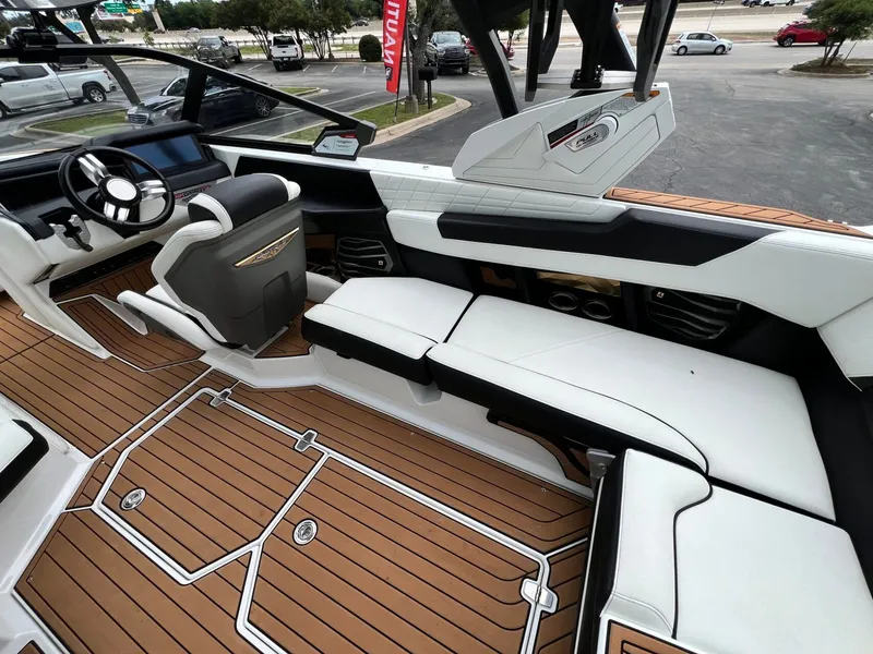 Slide: The Image of Interior of a 2021 Nautique G23 boat with luxurious features. - 18