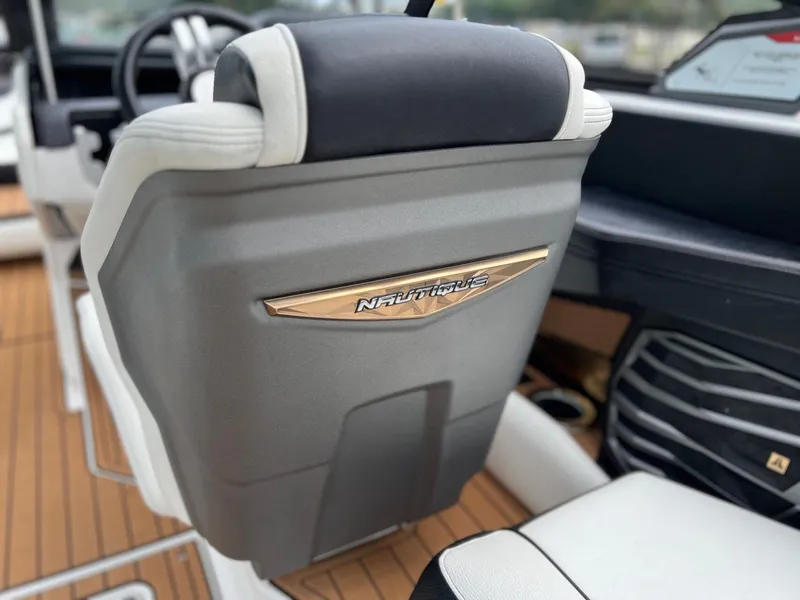 Slide: The Image of Interior of a 2021 Nautique G23 boat with stylish seat design. - 19