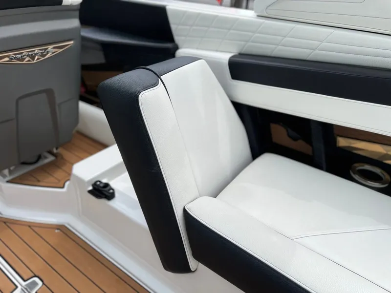 Slide: The Image of Interior of a 2021 Nautique G23 boat with luxurious seating. - 23