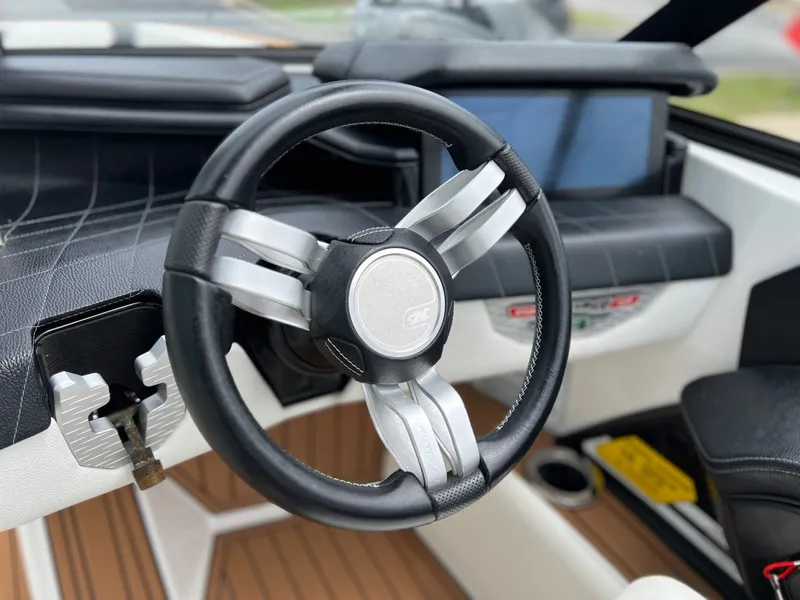 Slide: The Image of 2021 Nautique G23 steering wheel with modern design. - 24