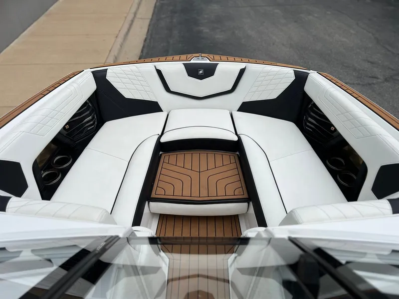 Slide: The Image of Interior of 2021 Nautique G23 with luxurious white seating. - 29