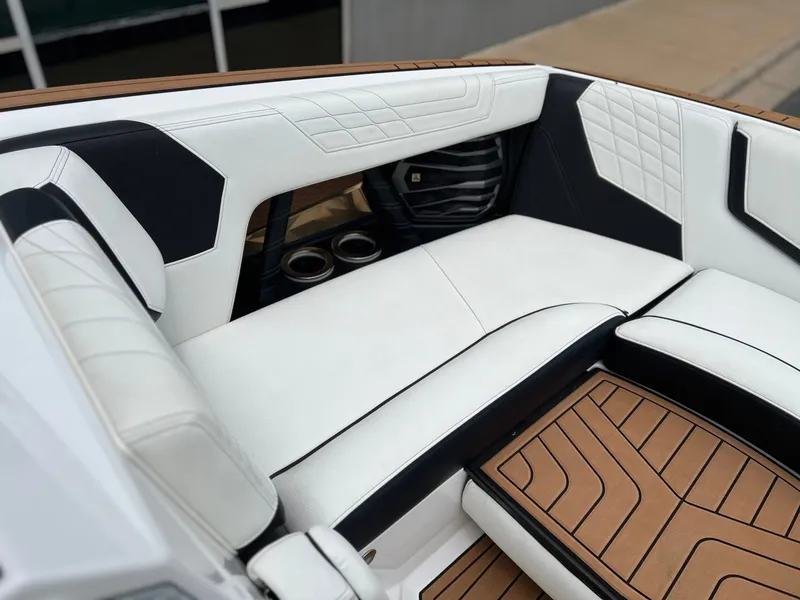 Slide: The Image of Interior of a 2021 Nautique G23 boat with luxurious upholstery. - 31