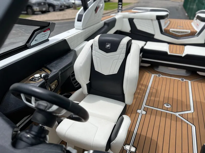 Slide: The Image of Interior of a 2021 Nautique G23 boat with luxurious seating. - 35