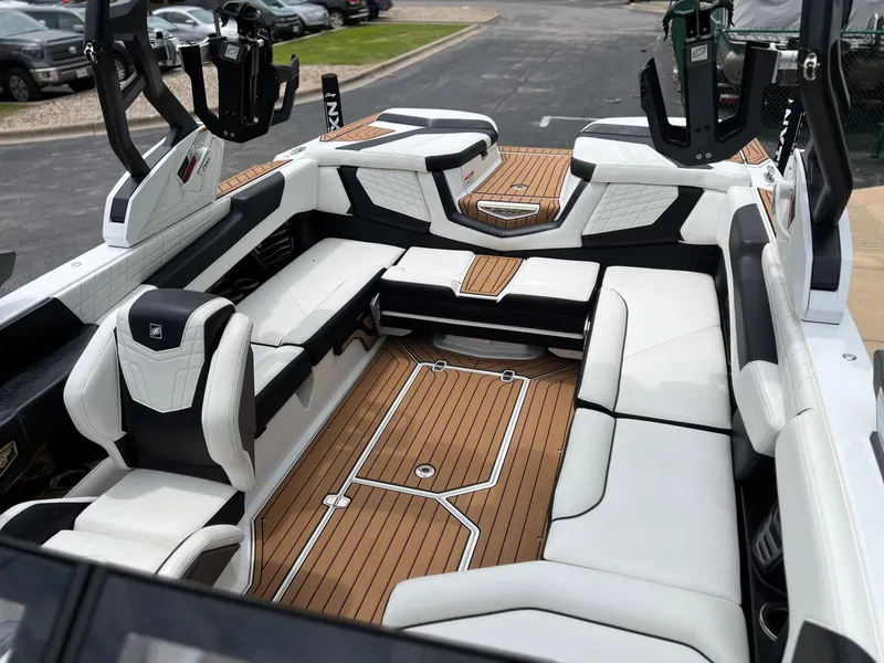 Slide: The Image of Interior of a 2021 Nautique G23 boat with luxurious seating. - 36