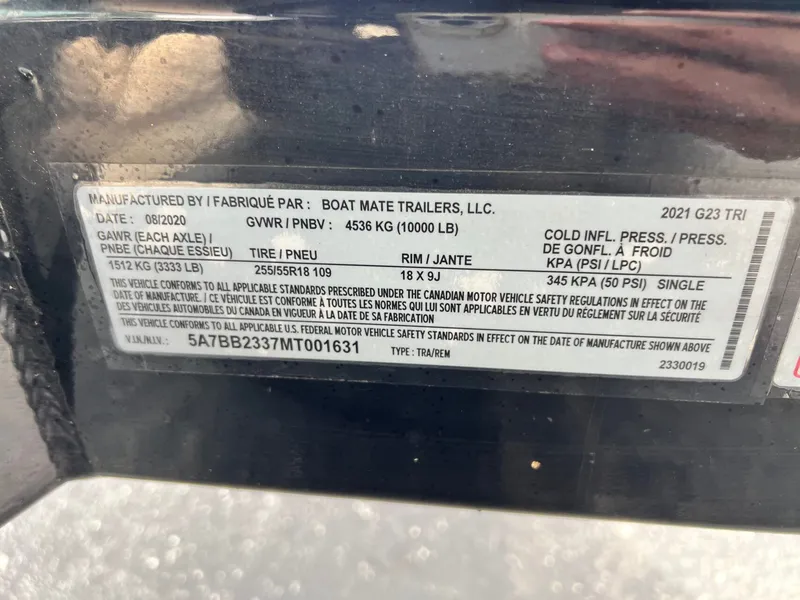 Slide: The Image of Nautique G23 2021 trailer label with technical specifications. - 39