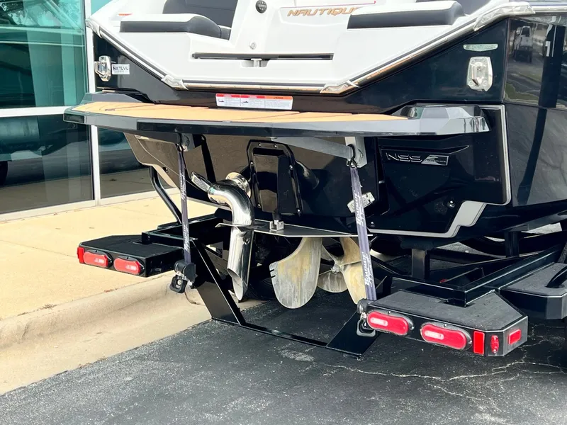 Slide: The Image of Rear view of a 2021 Nautique G23 boat on a trailer. - 4